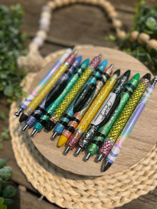 Glitter pens: pencil, composition, lined paper